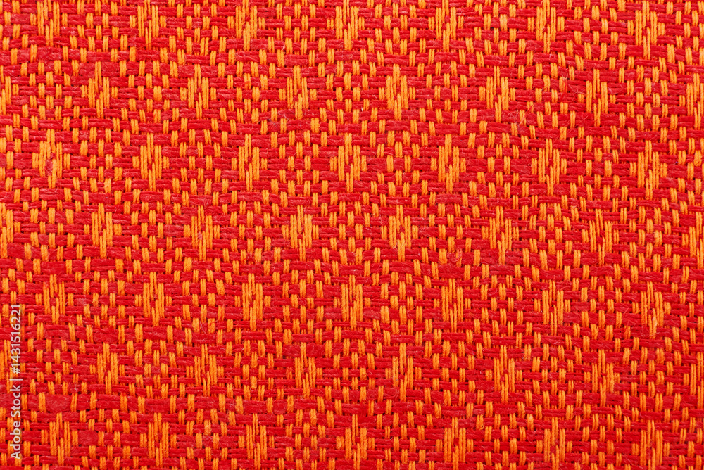 Poster texture of orange linen fabric with a pattern. pattern on textiles