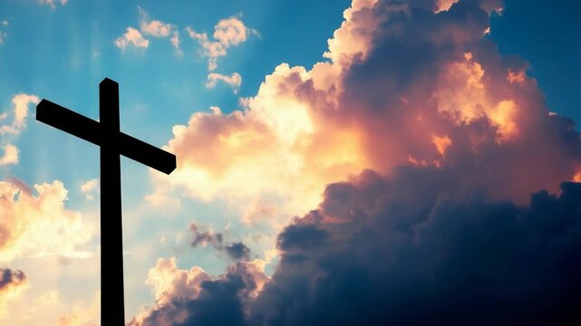Silhouette of a christian cross against a dramatic cloudy sky with vivid colors, conveying themes of faith, spirituality, and hope.