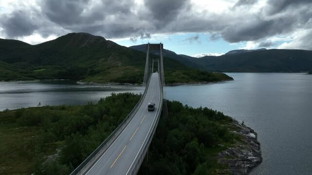 view of a vehicle going on Kjellingstraumen bru bridge crossing the Kjellingsundet strait in Norway