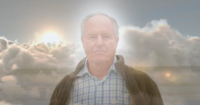 Image of glowing lights over a sad senior caucasian man - Powered by Adobe