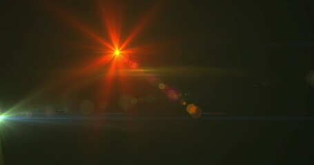 Image of glowing spots of lights over dark background