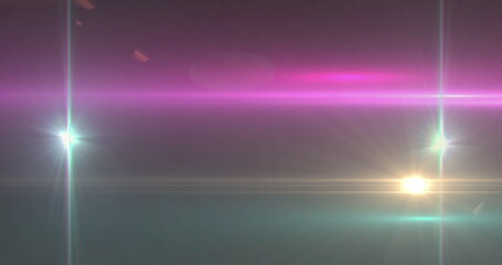 Image of glowing spots of lights over dark background