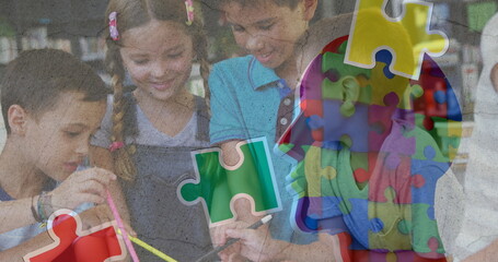 Image of puzzle pieces over diverse schoolchildren