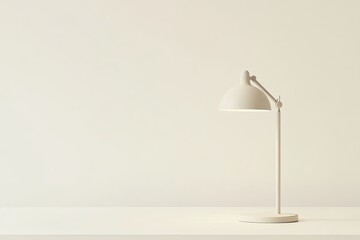 Minimalist white desk lamp on a white table against a white wall