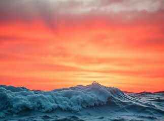Fototapeta premium Vibrant sunset casting fiery hues over the ocean waves, dynamic interplay of warm sky and cool water tones