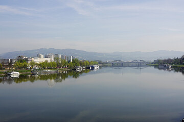 Fototapeta premium A riverside embankment in Linz, the river Danube, Austria 