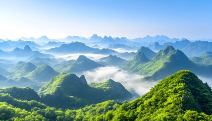Naklejka premium A panoramic view of rolling green hills and mountains with a layer of mist and fog