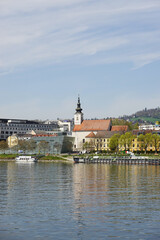Fototapeta premium A riverside embankment in Linz, the river Danube, Austria 