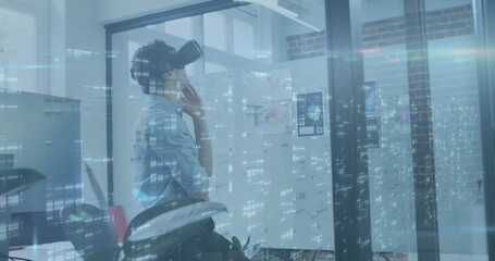 Image of data processing over caucasian businessman using vr headset