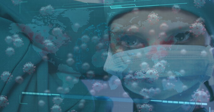 Displaying health worker wearing surgical mask scrub cap in digital panel with virus icons and map