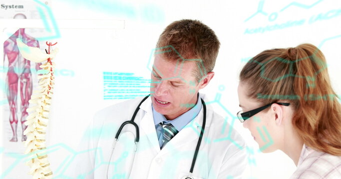 Image of scientific data processing over caucasian male and female doctors talking