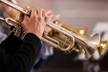  Hands of a musician playing the trumpet