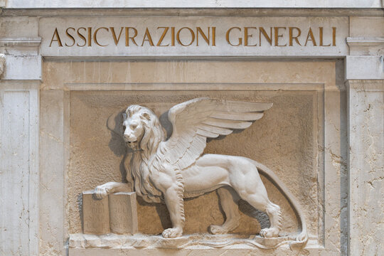 Venice, Italy - April 17 2025: Winged Lion of Saint Mark on facade of Assicurazioni Generali building