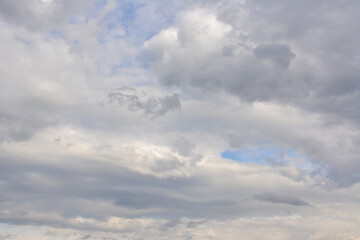 Overcast sky filled with fluffy clouds