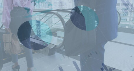 Image of financial data and graphs over diverse businesspeople walking to escalator