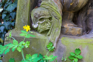Historic Statue on the spring mystery old Prague Cemetery, Czech Republic 