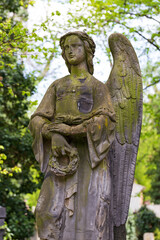 Obraz premium Historic Statue on the spring mystery old Prague Cemetery, Czech Republic 