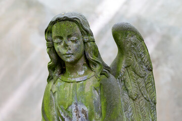 Historic Statue on the spring mystery old Prague Cemetery, Czech Republic 
