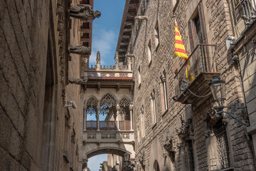 View of bridge between buildings in Barri Gotic quarter of Barcelona, Spain.