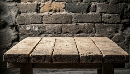 Fototapeta premium Rustic wooden table against aged brick wall