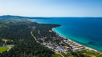 Aerial view of Novalja on Pag Island, Croatia. Famous for its beaches, vibrant summer atmosphere, and scenic Adriatic coastline. Captured by drone for a stunning panoramic perspective