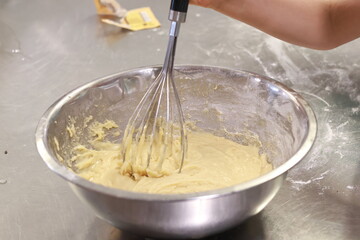 Baby woman hands mixing ingredients bowl indoors closeup. Unknown family cooking