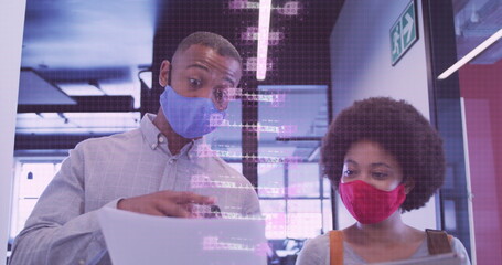 Image of dna rotating over african american man and woman in face mask in office
