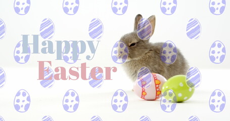 Fototapeta premium Image of easter eggs with bunny and happy easter text