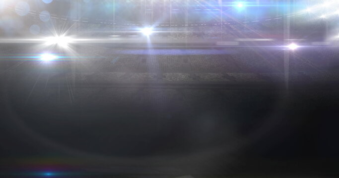 Image of light spots and stadium on black background