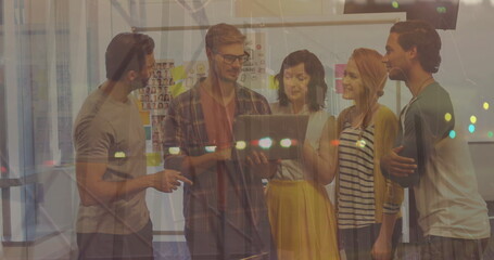 Statistical data processing and diverse office colleagues discussing over a laptop at office