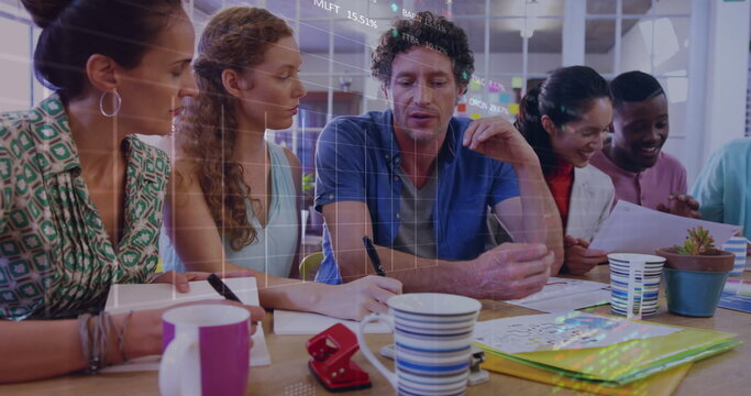 Stock market data processing over group of diverse office colleagues discussing together at office