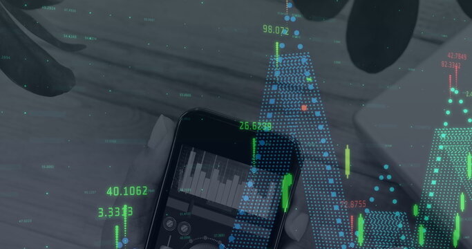 Image of financial data processing over hand holding smartphone