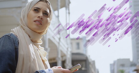 Image of shapes over biracial businesswoman using smartphone