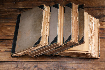 Many different old books on wooden table