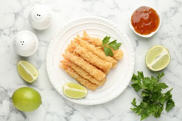 Tasty tempura shrimps served on white marble table, flat lay