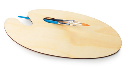 Wooden palette and brushes isolated on white