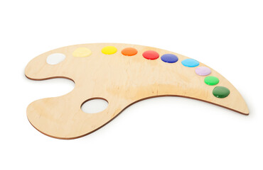 Wooden palette with paints isolated on white