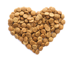 Heart shape made of dry pet food isolated on white, top view