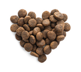 Heart shape made of dry pet food isolated on white, top view