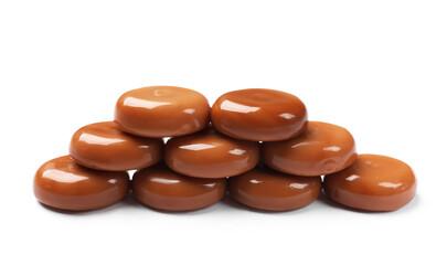 Tasty sweet caramel candies isolated on white