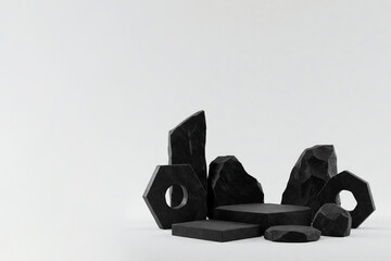 Black stones and geometric shapes on a light background. Space for text.
