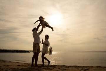 Happy family beach sunset. Children vacations. daughter mother father. parent and children enjoy the sunset sea on beach. Holiday travel concept, Summer vacations.