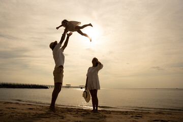 Happy family beach sunset. Children vacations. daughter mother father. parent and children enjoy the sunset sea on beach. Holiday travel concept, Summer vacations.