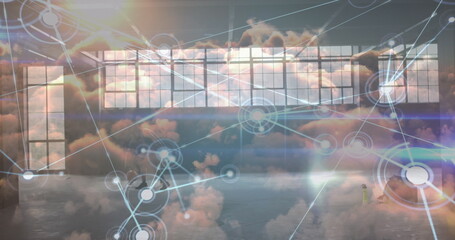 Image of data processing over clouds and male basketball players at gym