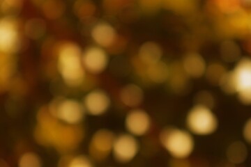 Abstract Gold and Brown Bokeh Background with Soft Light Effects