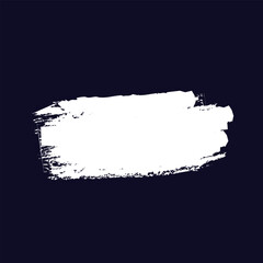 white paint brush stroke on a dark blue background. The edges of the stroke are uneven and textured, suggesting a dry brush or a quick application of paint.