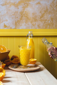 Orange juice in a bottle and glass