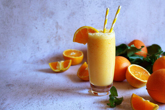 Healthy Breakfast Smoothie Made with Fresh Orange Juice and Coconut Milk with Negative Space