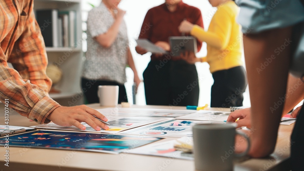 Poster a dynamic workspace showcases a diverse team collaborating on creative projects, discussing innovati