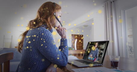 Image of light spots over caucasian woman making image call